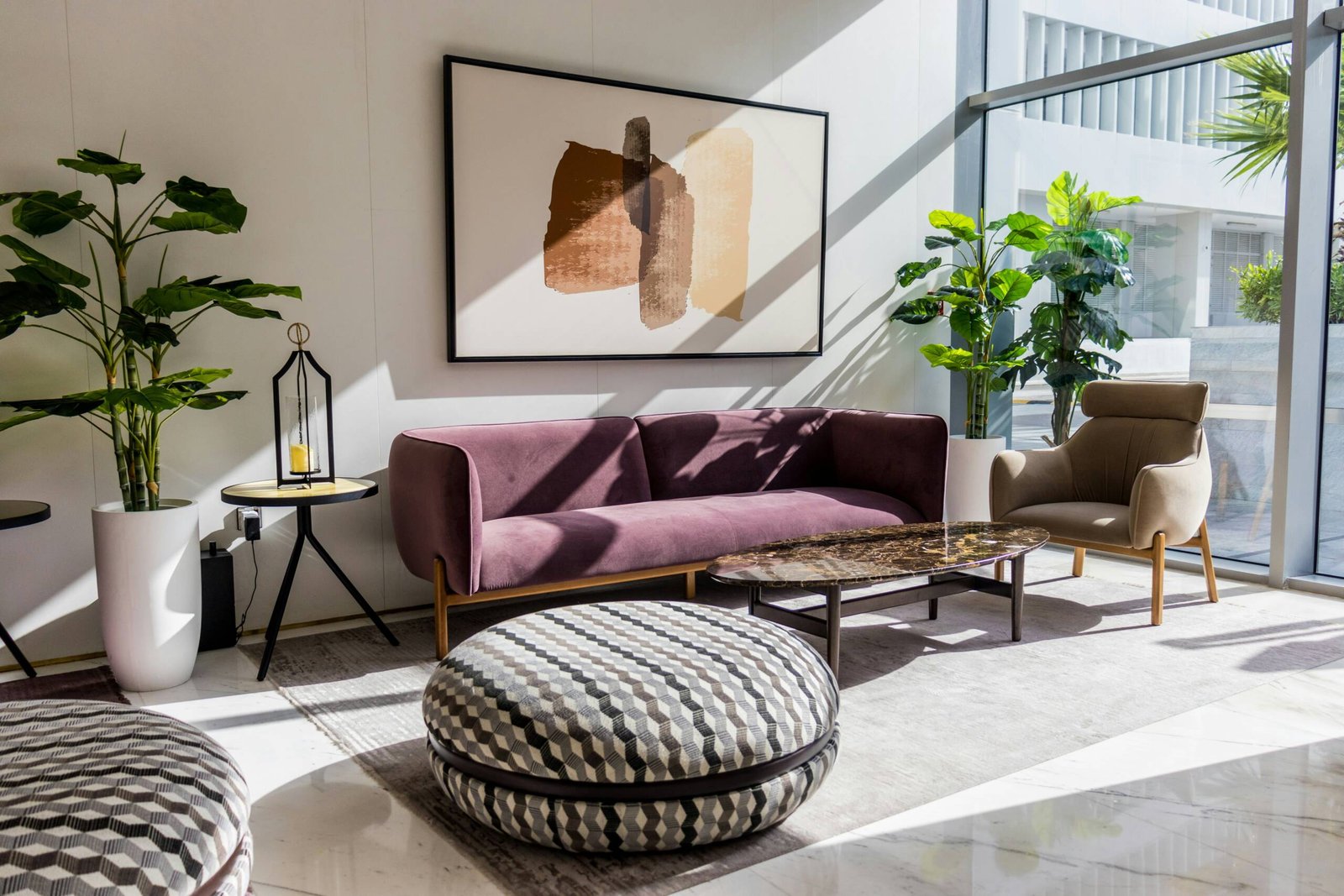 a living room filled with furniture and a large window